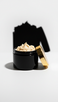 Whipped body butter in black and gold jar